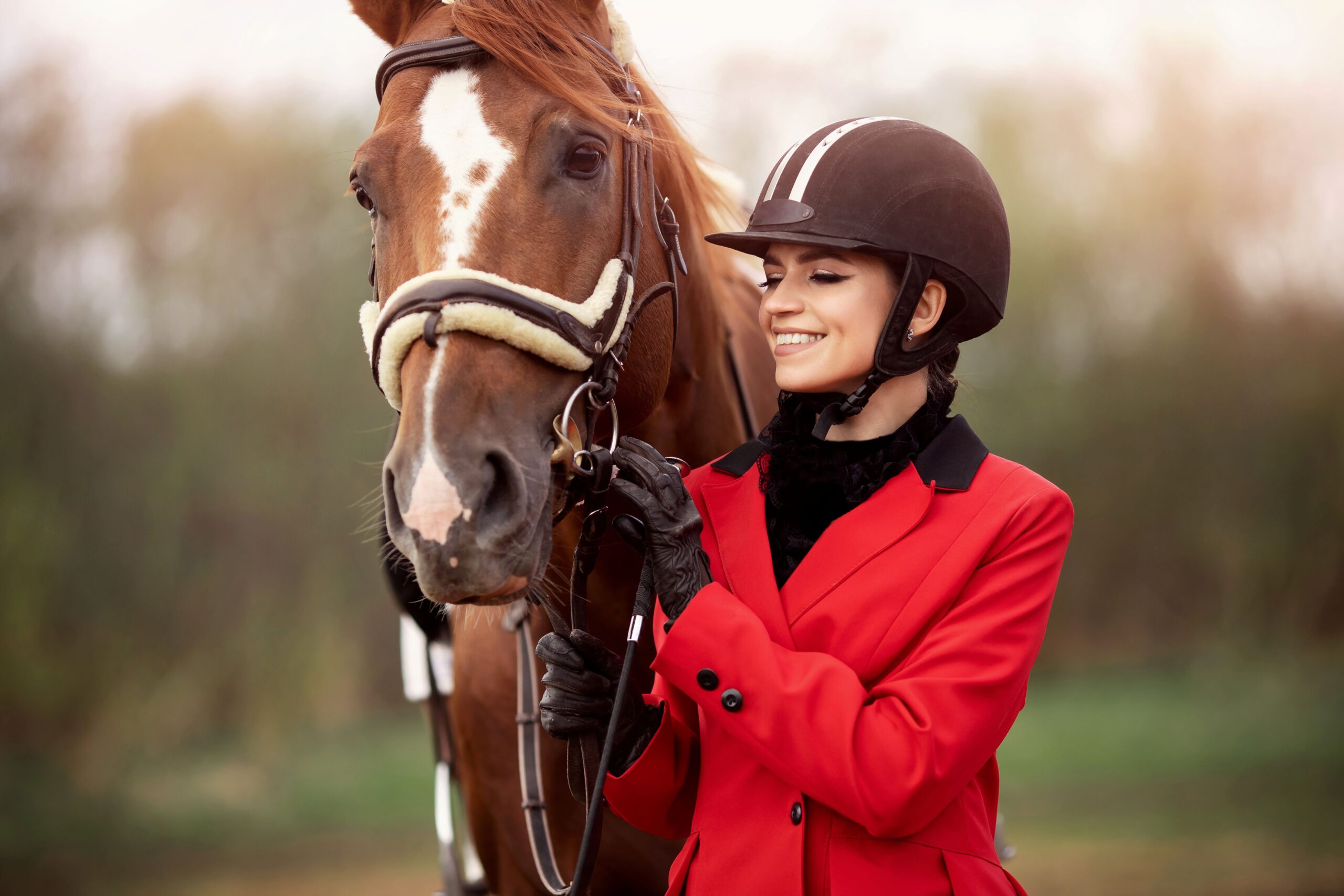 Rider standing beside a calm horse, highlighting trust and partnership that support long-term success